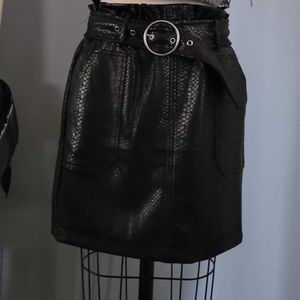Black mini skirt snakeskin imitation with belt.